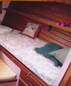 teak paneling in forepeak cabin